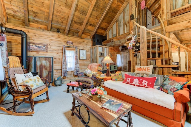 W3562 Glencoe Ave, Montello, WI 53949 - living area featuring wood walls, a wooden ceiling with exposed beams, high vaulted ceiling, a wood stove, and carpet