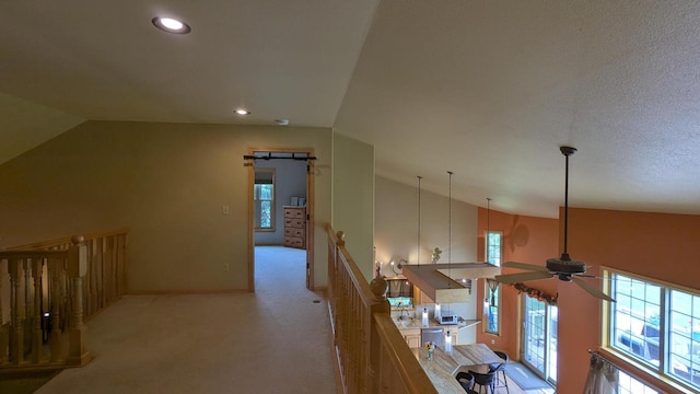 N100W17560 Whitetail Run, Germantown, WI 53022 - corridor with vaulted ceiling, healthy amount of natural light, an upstairs landing, light carpet, and recessed lighting