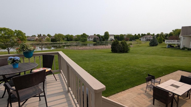 N100W17560 Whitetail Run, Germantown, WI 53022 - deck with a water view, outdoor dining area, a lawn, and a patio