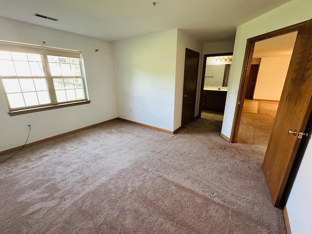 18740 Emerald Cir Unit D, Brookfield, WI 53045 - unfurnished bedroom with carpet flooring and connected bathroom