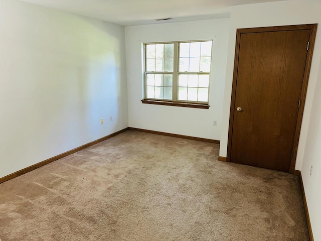 18740 Emerald Cir Unit D, Brookfield, WI 53045 - unfurnished room featuring carpet and baseboards
