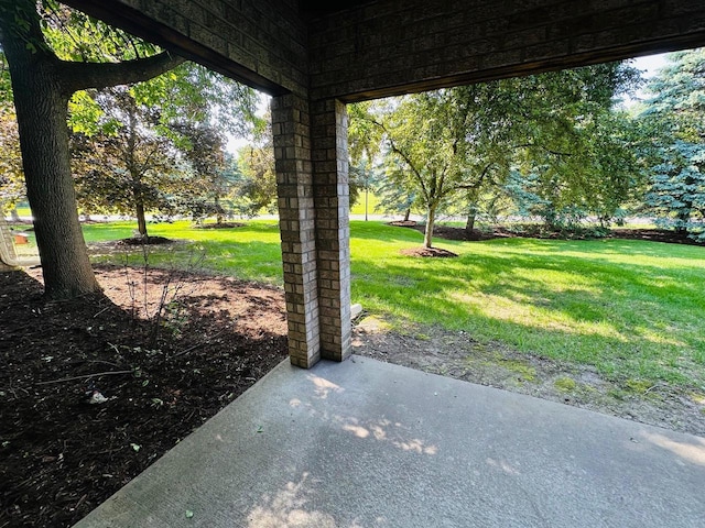 18740 Emerald Cir Unit D, Brookfield, WI 53045 - view of grassy yard featuring a patio