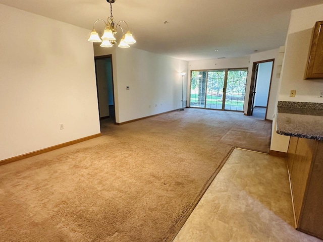 18740 Emerald Cir Unit D, Brookfield, WI 53045 - unfurnished dining area with light colored carpet and a chandelier
