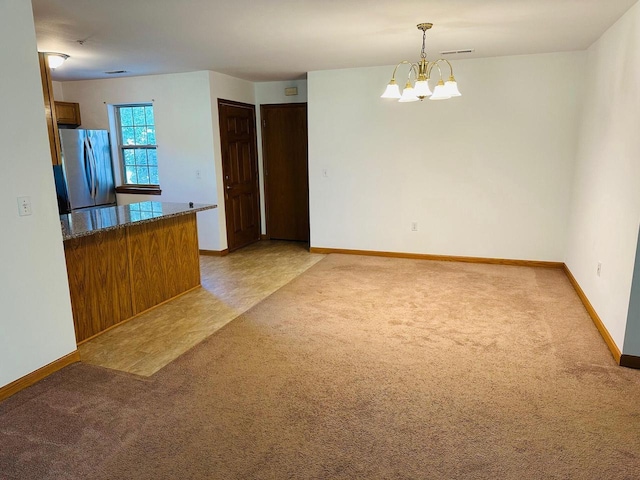 18740 Emerald Cir Unit D, Brookfield, WI 53045 - unfurnished dining area featuring light colored carpet and a chandelier