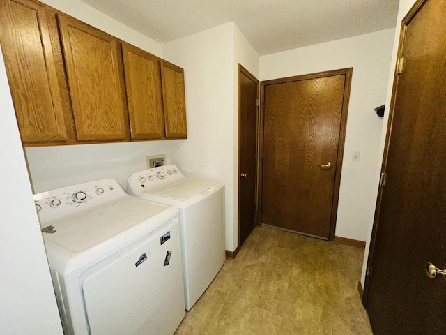 18740 Emerald Cir Unit D, Brookfield, WI 53045 - washroom featuring washing machine and clothes dryer, cabinet space, and light floors