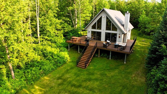 5872W Otter Ln, Winter, WI 54896 - back of house with a deck, stairway, a yard, and a chimney