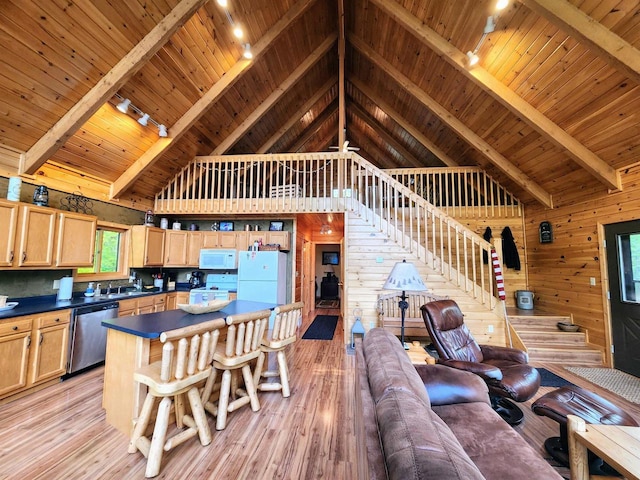 5872W Otter Ln, Winter, WI 54896 - living area with rail lighting, a wooden ceiling with exposed beams, high vaulted ceiling, wood walls, and light wood-style floors
