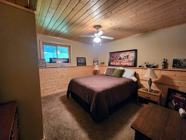 5872W Otter Ln, Winter, WI 54896 - carpeted bedroom with wooden ceiling, wooden walls, and a ceiling fan