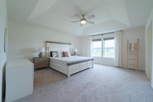 N56W24235 Torrey Pines Ln, Sussex, WI 53089 - bedroom with a raised ceiling, light carpet, and a ceiling fan
