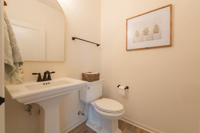 N56W24235 Torrey Pines Ln, Sussex, WI 53089 - half bath featuring wood finished floors and toilet
