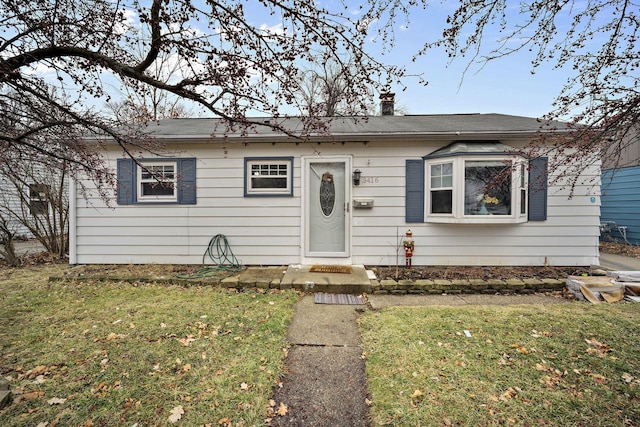 3416 S 66th St, Milwaukee, WI 53219 - bungalow with a front yard and a chimney