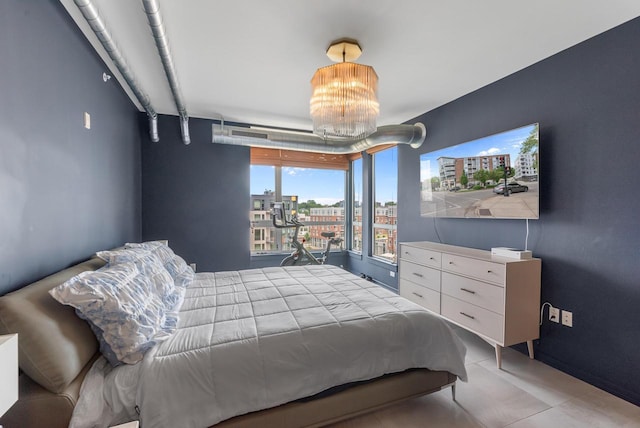 1541 N Jefferson St Unit 408, Milwaukee, WI 53202 - bedroom featuring a chandelier and light tile patterned flooring