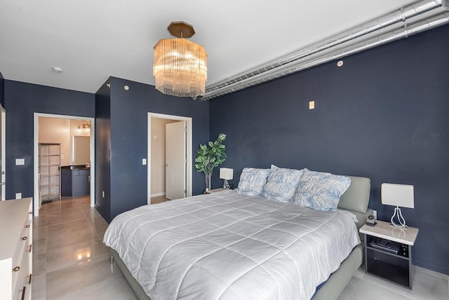 1541 N Jefferson St Unit 408, Milwaukee, WI 53202 - bedroom featuring a chandelier and baseboards