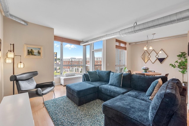 1541 N Jefferson St Unit 408, Milwaukee, WI 53202 - living area featuring light wood finished floors and baseboards