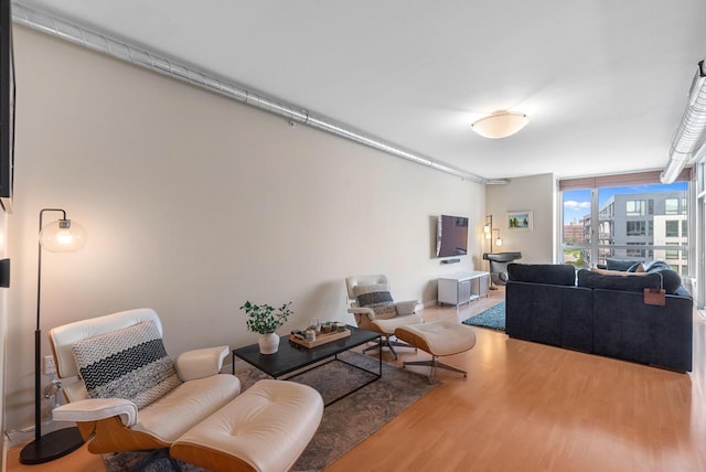 1541 N Jefferson St Unit 408, Milwaukee, WI 53202 - living room featuring wood finished floors