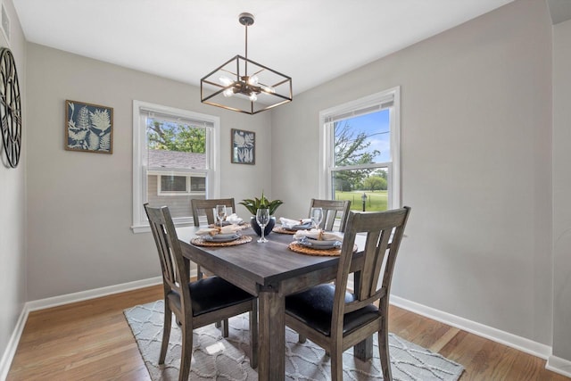4410 N 107th St, Milwaukee, WI 53225 - dining room with plenty of natural light, a chandelier, and light wood-type flooring