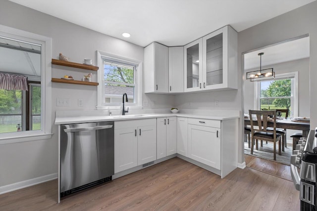4410 N 107th St, Milwaukee, WI 53225 - kitchen featuring stainless steel dishwasher, light countertops, and healthy amount of natural light