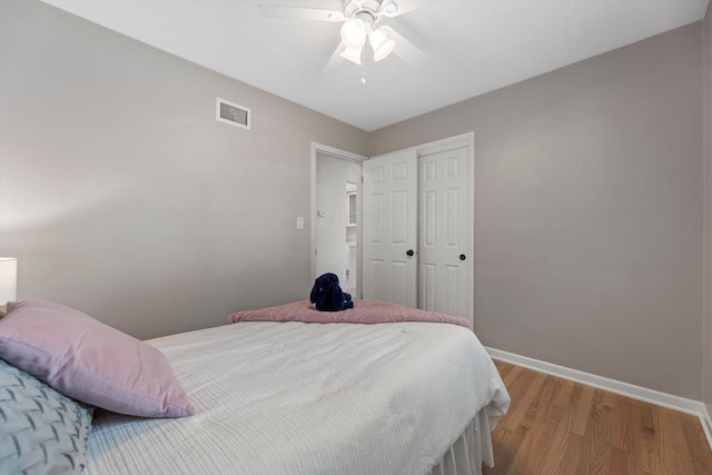 4410 N 107th St, Milwaukee, WI 53225 - bedroom featuring light wood-style flooring, a closet, and a ceiling fan