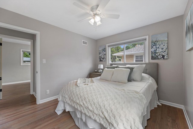 4410 N 107th St, Milwaukee, WI 53225 - bedroom featuring multiple windows, wood finished floors, and a ceiling fan