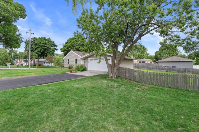 4410 N 107th St, Milwaukee, WI 53225 - view of front of property featuring a garage and asphalt driveway