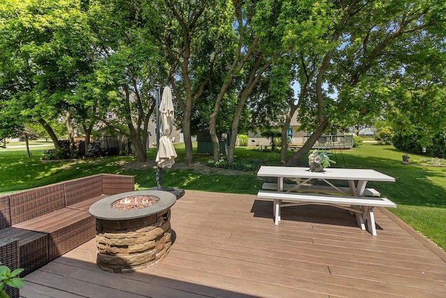 606 E Sheila Ave, Elkhorn, WI 53121 - wooden deck featuring an outdoor fire pit and a yard