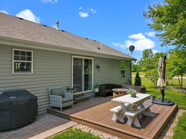 606 E Sheila Ave, Elkhorn, WI 53121 - deck with outdoor dining space, an outdoor fire pit, and a lawn