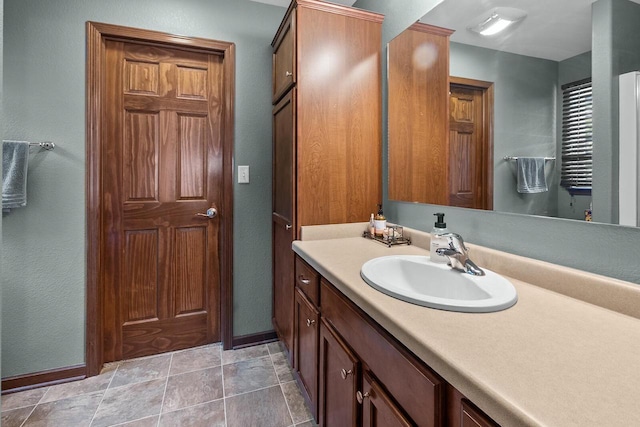 606 E Sheila Ave, Elkhorn, WI 53121 - bathroom with vanity and stone finish floors