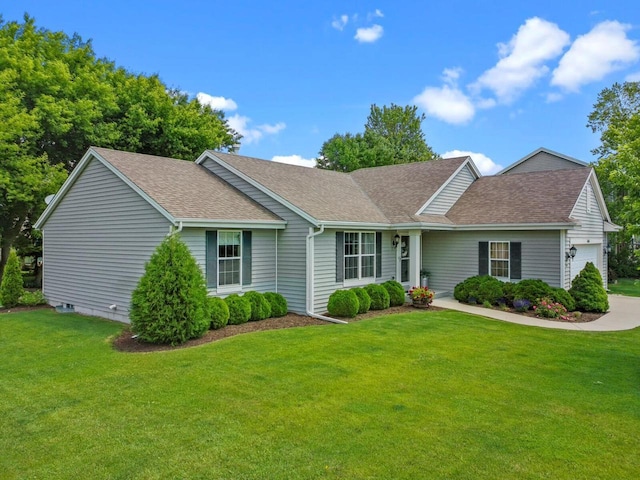606 E Sheila Ave, Elkhorn, WI 53121 - ranch-style house featuring roof with shingles, a front yard, and an attached garage
