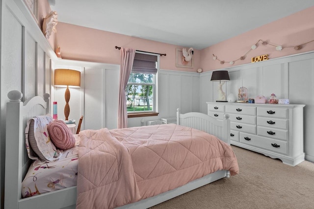 606 E Sheila Ave, Elkhorn, WI 53121 - carpeted bedroom with a decorative wall and wainscoting