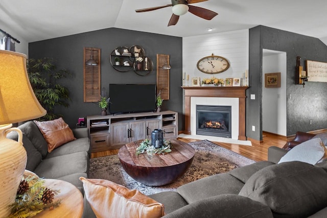 606 E Sheila Ave, Elkhorn, WI 53121 - living area with ceiling fan, wood finished floors, lofted ceiling, and a fireplace