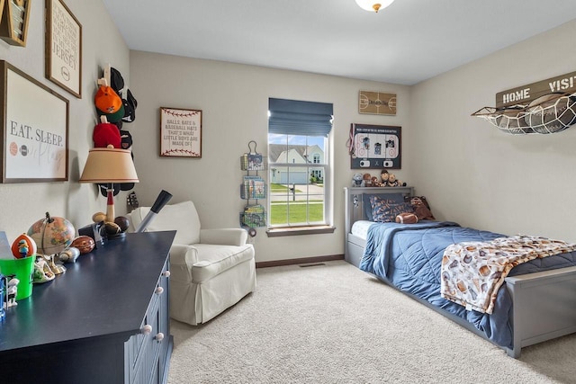 606 E Sheila Ave, Elkhorn, WI 53121 - bedroom with light carpet and baseboards