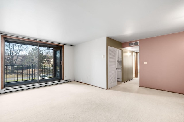 8735 N 72nd St Unit 202, Milwaukee, WI 53223 - unfurnished room featuring baseboard heating and light colored carpet