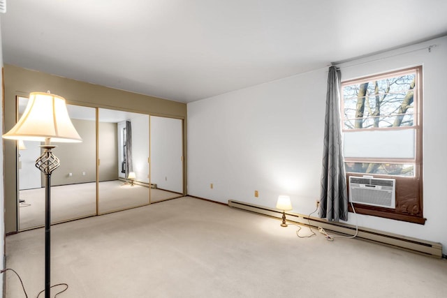 8735 N 72nd St Unit 202, Milwaukee, WI 53223 - unfurnished bedroom with a baseboard radiator and light carpet