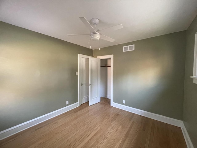 3402 N 51st Blvd, Milwaukee, WI 53216 - unfurnished bedroom featuring wood finished floors, a closet, and a ceiling fan