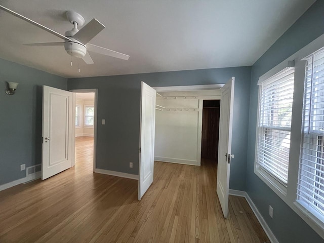 3402 N 51st Blvd, Milwaukee, WI 53216 - unfurnished bedroom featuring wood finished floors, a ceiling fan, and a closet