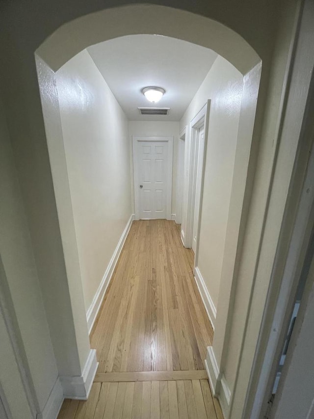 3402 N 51st Blvd, Milwaukee, WI 53216 - corridor featuring light wood-style floors and arched walkways