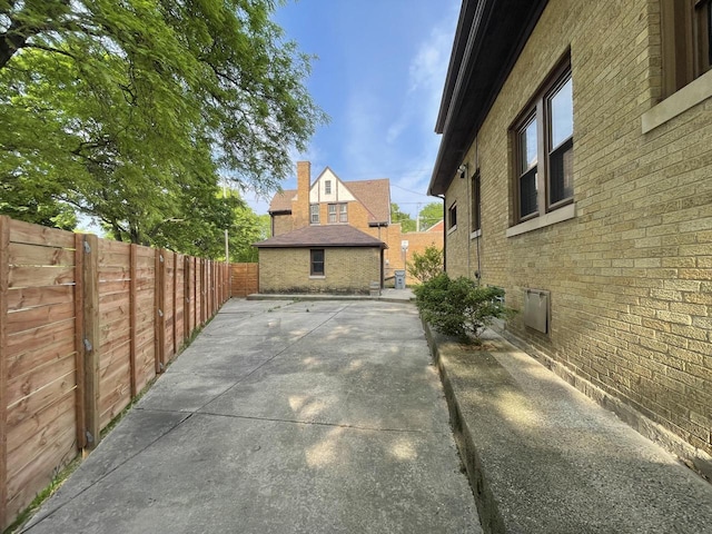3402 N 51st Blvd, Milwaukee, WI 53216 - view of side of property with a patio area and brick siding
