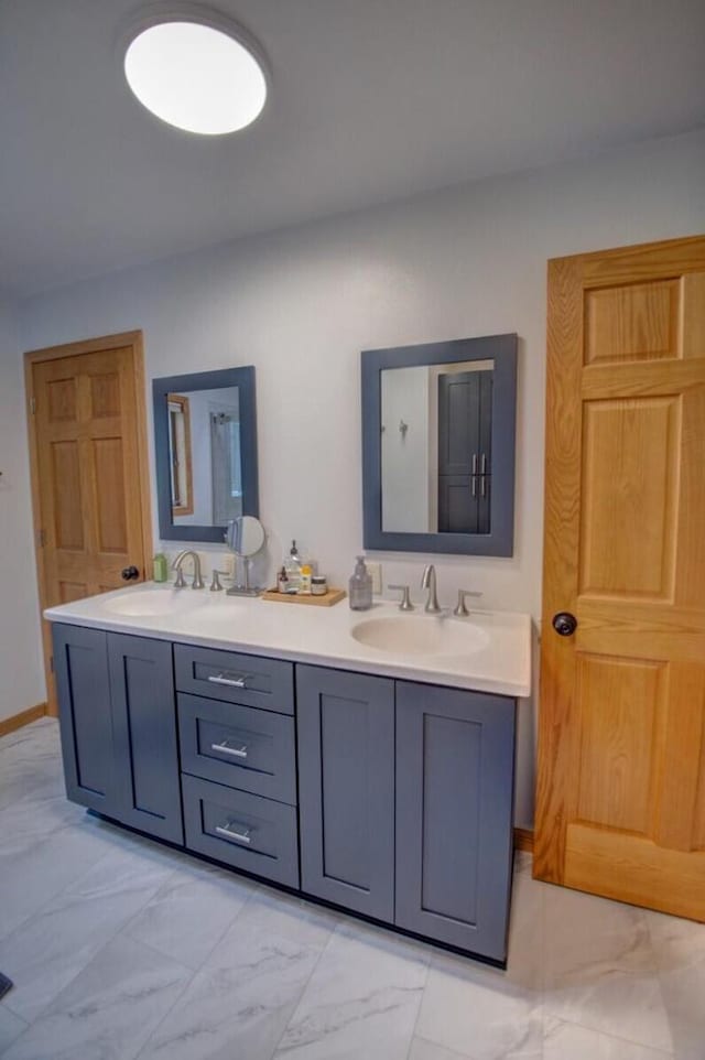 N4374 Esther Dr, Onalaska, WI 54650 - bathroom with marble look tiles and double vanity