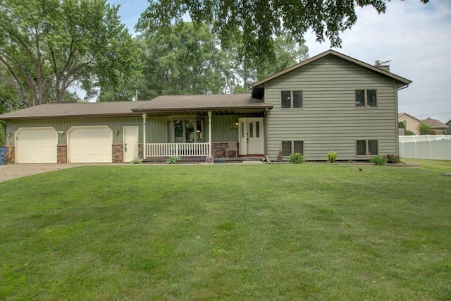 N4374 Esther Dr, Onalaska, WI 54650 - tri-level home featuring a porch, an attached garage, board and batten siding, and driveway