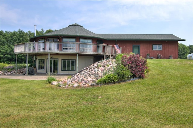 668 18th St, Chetek, WI 54728 - back of house with a wooden deck and a lawn