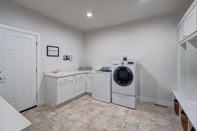3007 Mourning Dove Dr, Cottage Grove, WI 53527 - laundry area featuring cabinet space, washer and clothes dryer, and recessed lighting