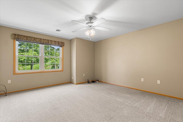 677 Wood River Ct, West Bend, WI 53095 - empty room featuring light colored carpet and ceiling fan