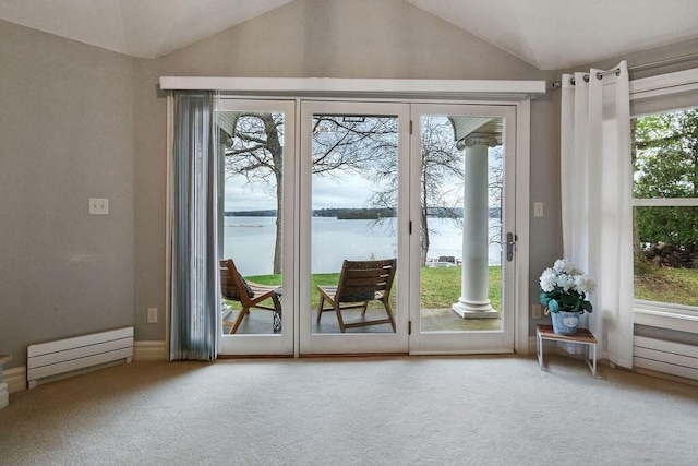 900 Hawks Holw, Delafield, WI 53018 - doorway to outside featuring lofted ceiling, carpet flooring, and a water view
