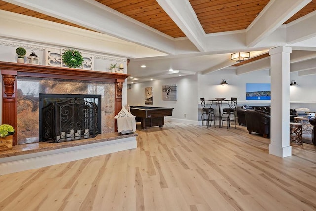 900 Hawks Holw, Delafield, WI 53018 - living room with wood finished floors, billiards, a premium fireplace, ornamental molding, and ornate columns