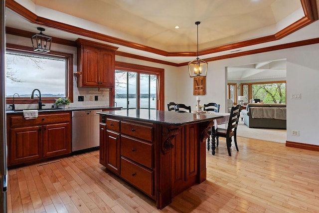900 Hawks Holw, Delafield, WI 53018 - kitchen featuring stainless steel dishwasher, a raised ceiling, a kitchen island, light wood-style floors, and ornamental molding