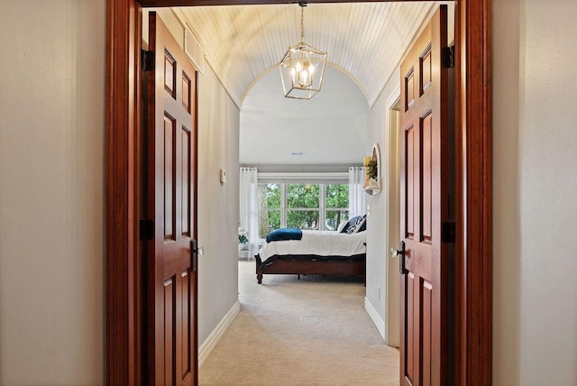 900 Hawks Holw, Delafield, WI 53018 - hall featuring a chandelier, light carpet, and vaulted ceiling