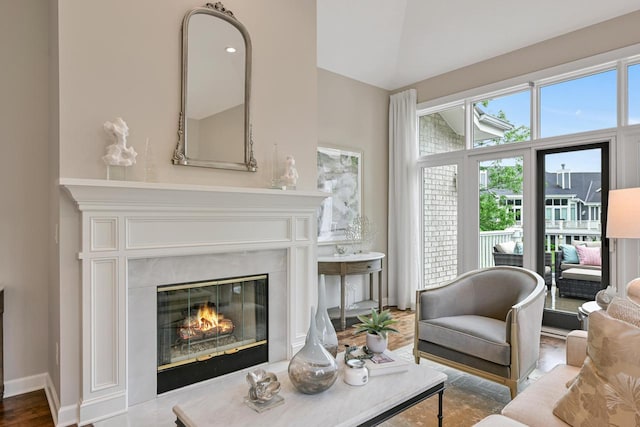 17185 Lake Rd Unit C, Brookfield, WI 53005 - living area with a high end fireplace and wood finished floors