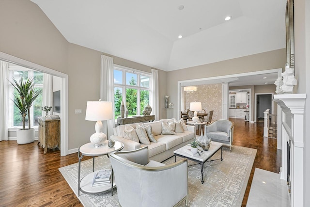 17185 Lake Rd Unit C, Brookfield, WI 53005 - living room with lofted ceiling, dark wood-style flooring, a premium fireplace, and recessed lighting