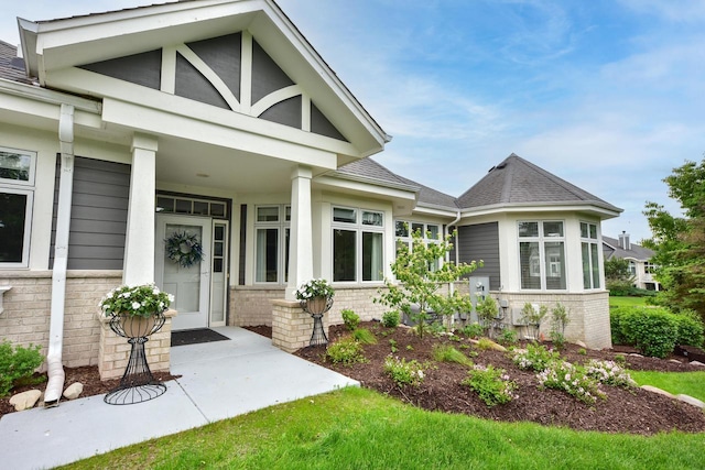 17185 Lake Rd Unit C, Brookfield, WI 53005 - property entrance with brick siding, a shingled roof, and a porch