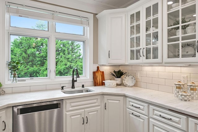 17185 Lake Rd Unit C, Brookfield, WI 53005 - kitchen featuring stainless steel dishwasher, white cabinets, backsplash, and ornamental molding